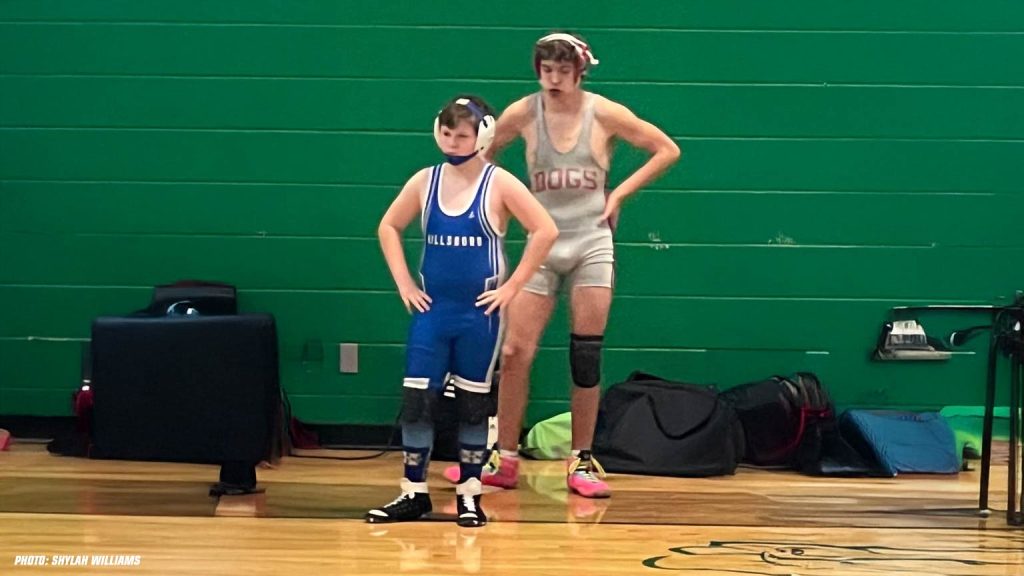 Tucker in 7th grade with one of his opponents